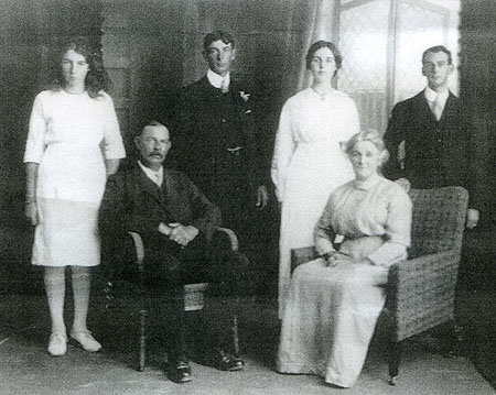 Image Pitcher family, circa 1915.<br>Dora Annie, Alfred George, Laura Amy, Francis Reuben<br>James George & Annie (nee Nolan). (Photo supplied by Diane Oliver.)